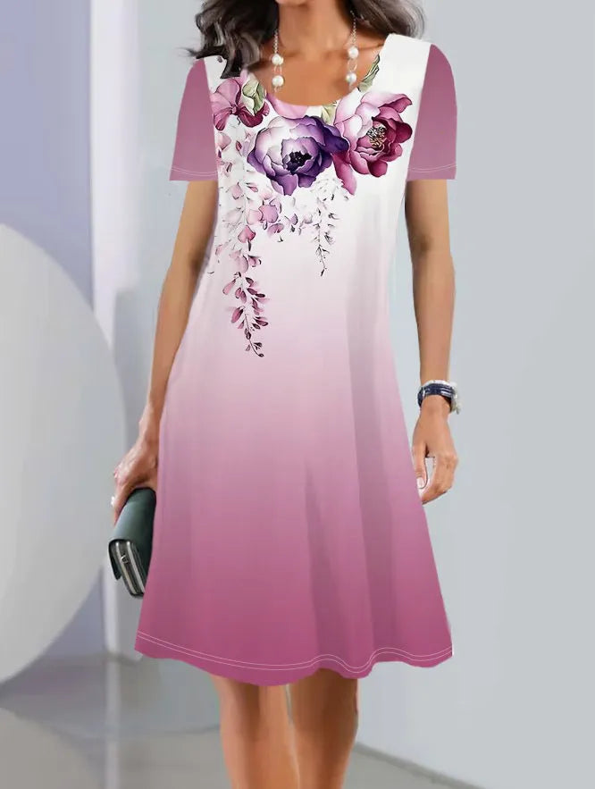 Women's light blue floral print A-line summer dress with short sleeves on a hanger.