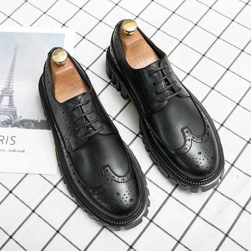 Men's black brogue leather shoes with round toe on a solid background