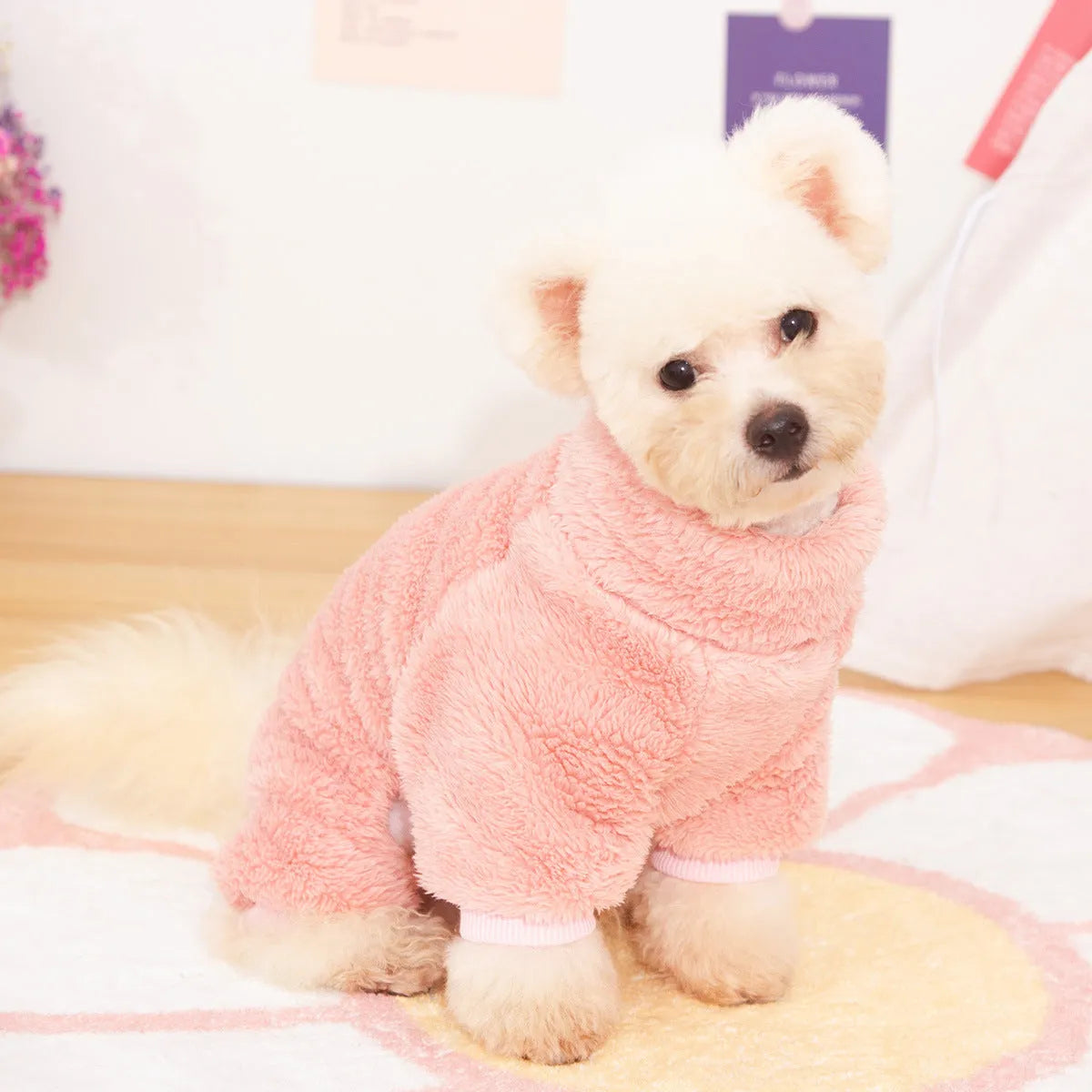 Khaki four-legged dog jumper with high collar and a towing ring on the back, made of thick plush fabric.