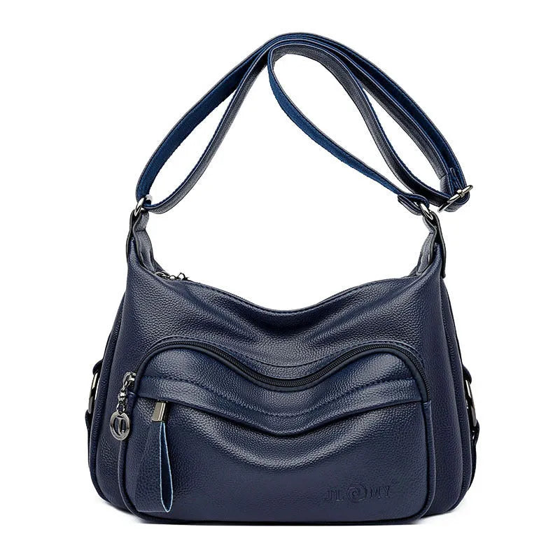 Women's blue crossbody shoulder bag with multiple interior pockets and zip closure