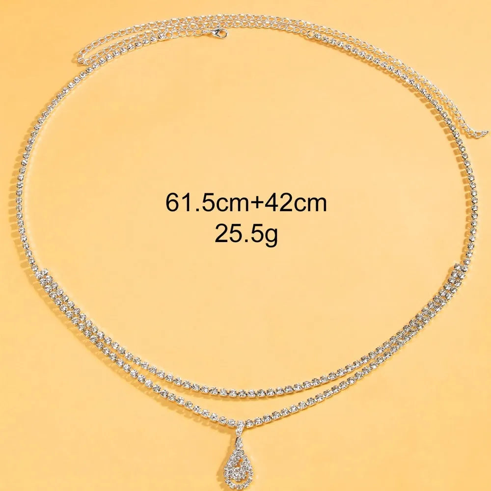 Gold or silver women's waist chain with water drop pendant and rhinestone decoration, showing lobster clasp closure.