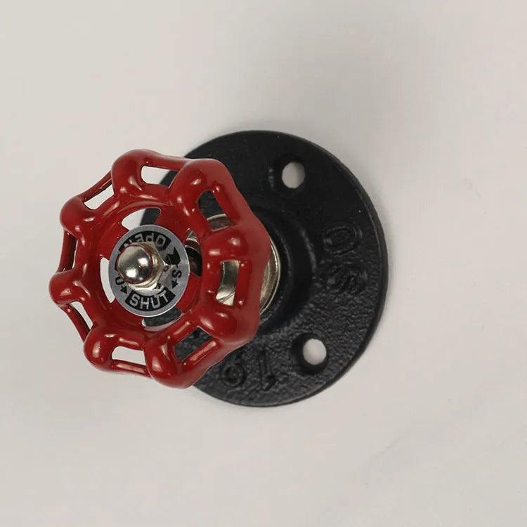 Polished metal wall hook in water pipe style for towels, in black, green, or red.