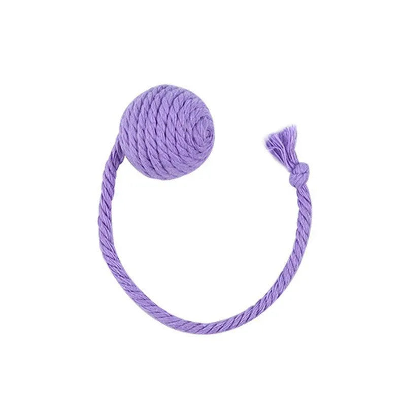 Cat toy ball with rope attached in green, pink, purple, or yellow colours with internal bell
