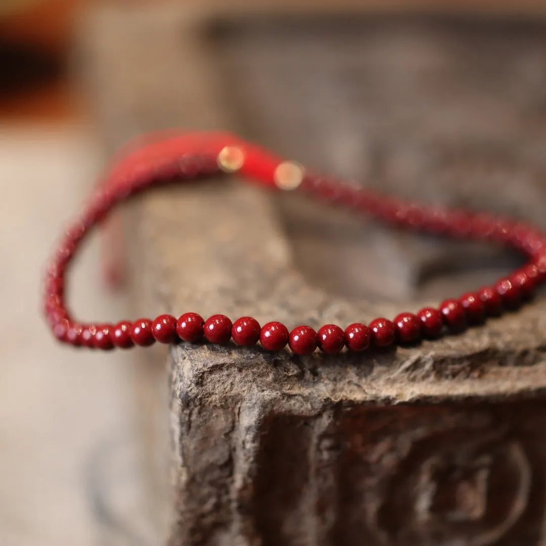 Handmade natural cinnabar bracelet with purple gold sand design and geometric Chinese auspicious patterns