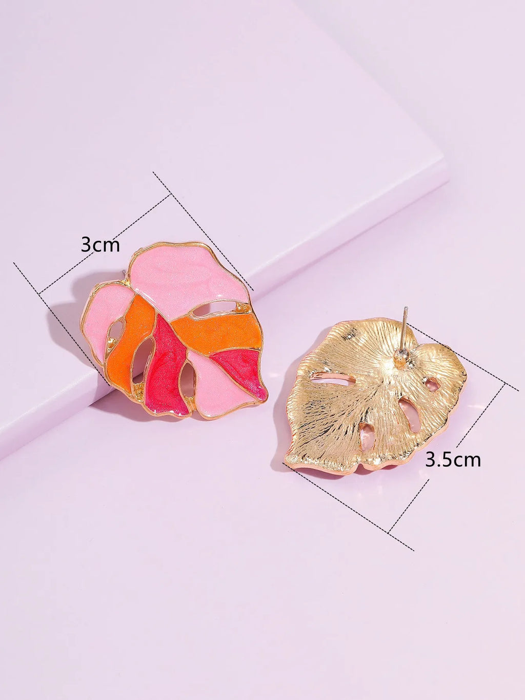 Maple leaf stud earrings with handmade drop oil finish, electroplated alloy, available in green or pink.