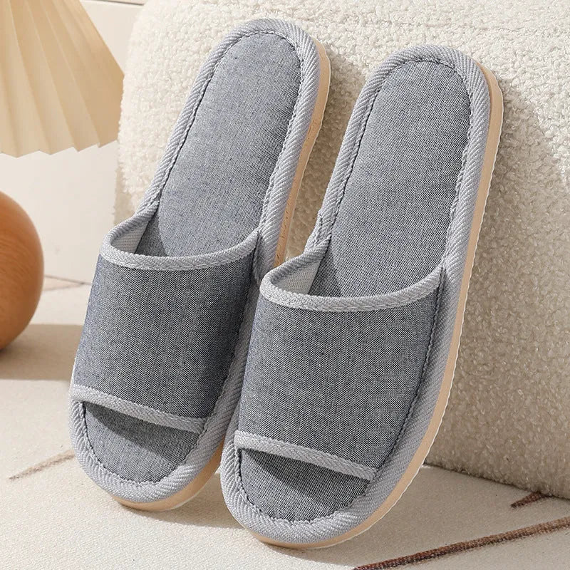 Women's open-toe slippers in linen and cotton, shown in a marled red colour with a thickened sole.