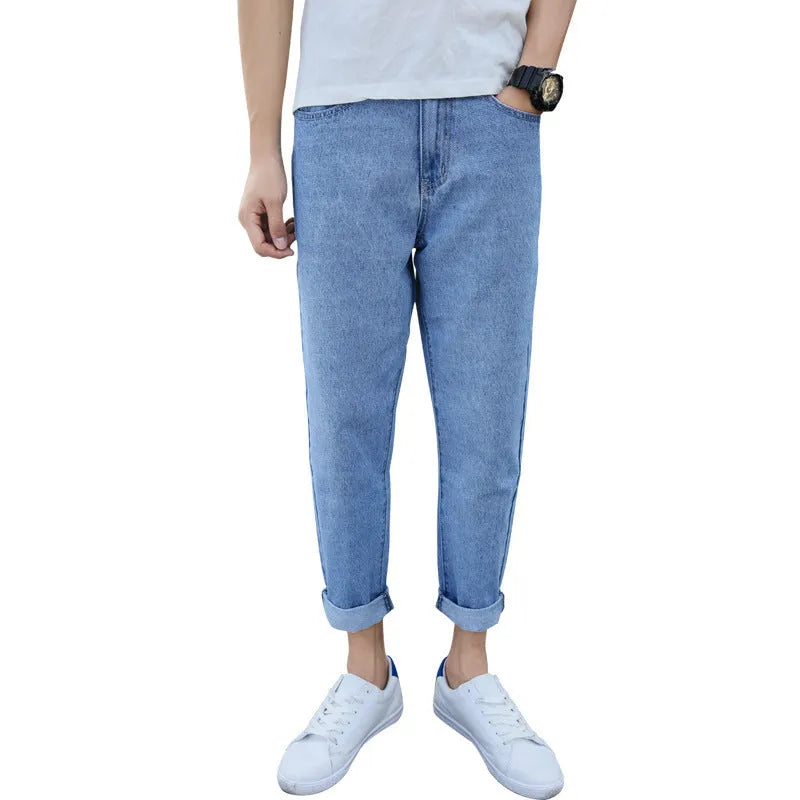 Men's loose straight-leg harem jeans in cotton, shown in blue colour on a neutral background.