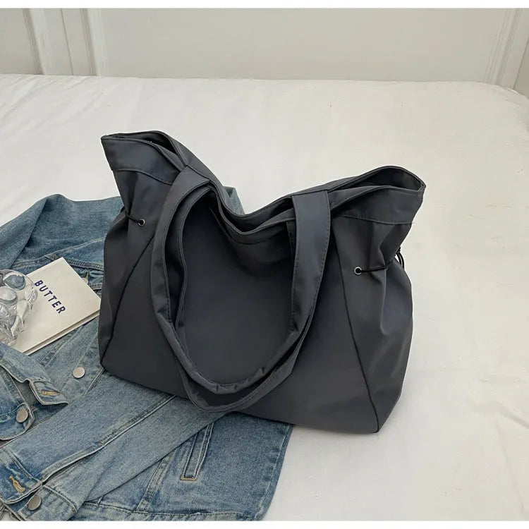 Soft Oxford cloth folding tote bag shown in multiple colours: black, brown, grey, and purple.