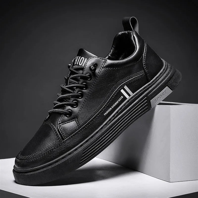 Men's low-top skate shoes with elastic band, microfiber upper, and round toe in black and white.