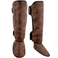 PU vertical thickened fighting boxing shin guards in brown colour on training mat