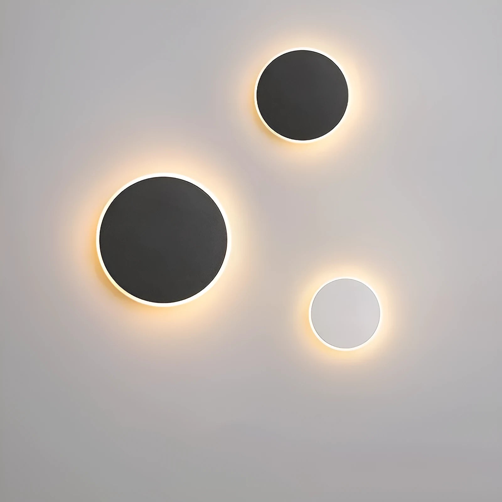Round LED wall lamp 13cm diameter in black finish for bedside or corridor