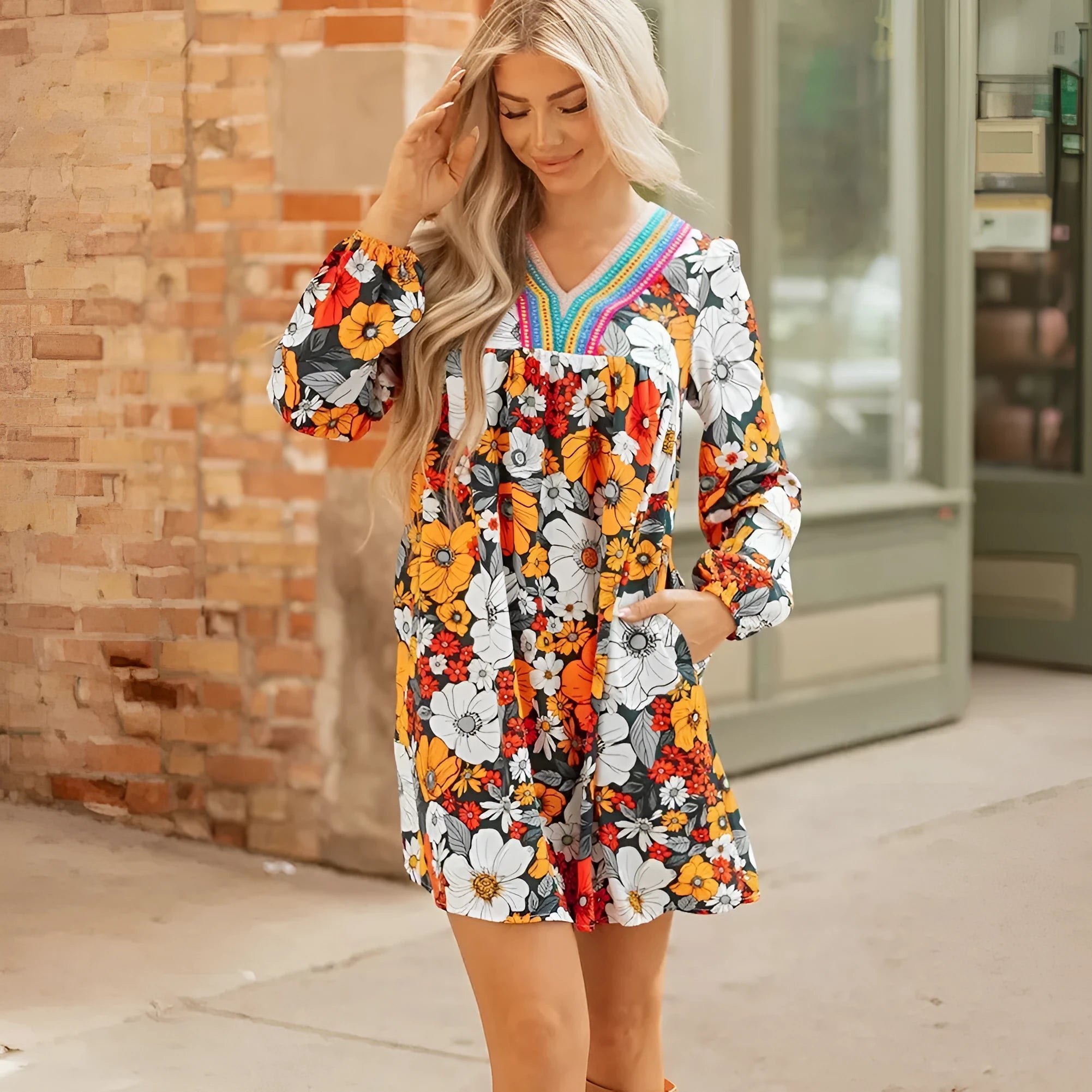 Orange floral print mini dress with V neck, long sleeves and vertical striped lace detailing