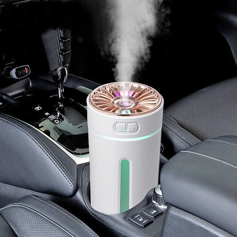 Black portable USB humidifier with colourful lights on car dashboard