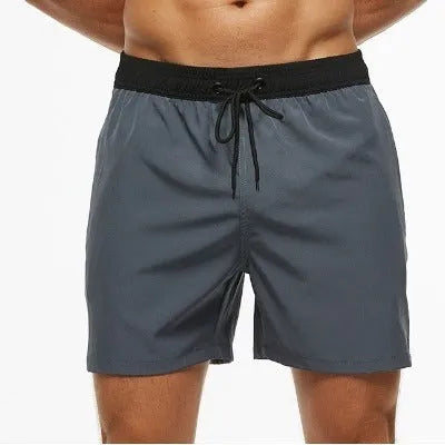 Men's blue athletic shorts with stitching waistband, drawstring and headband for running