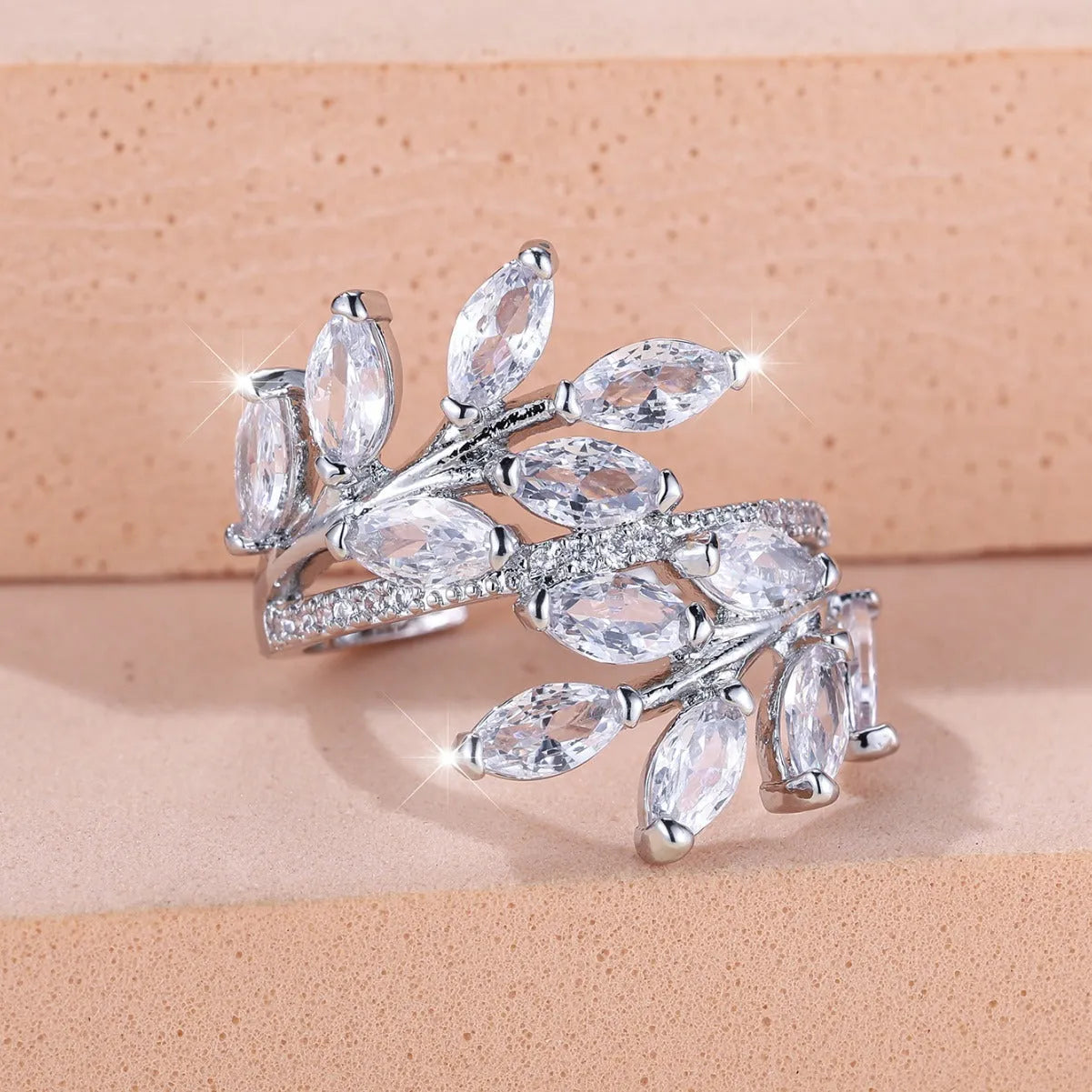 Adjustable leaf-shaped ring with horse eye cubic zirconia design in copper with rose gold plating