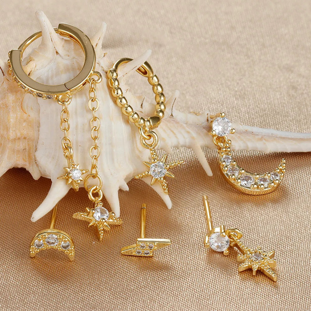 Set of six gold-colour chain tassel earrings with zircon studs, shown arranged together.