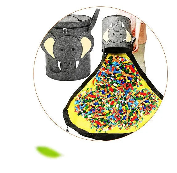 Green felt cube storage bag open as a play mat next to toys, showing pull rope closure