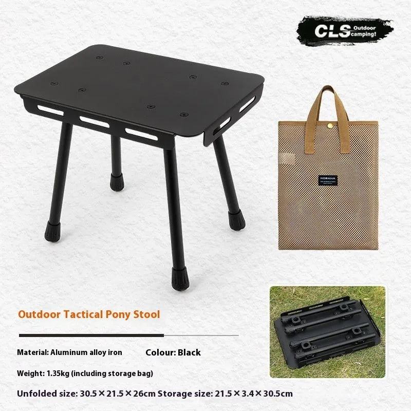 CLS aluminium folding camping stool shown in army green, converted into a small raised table next to a storage bag.