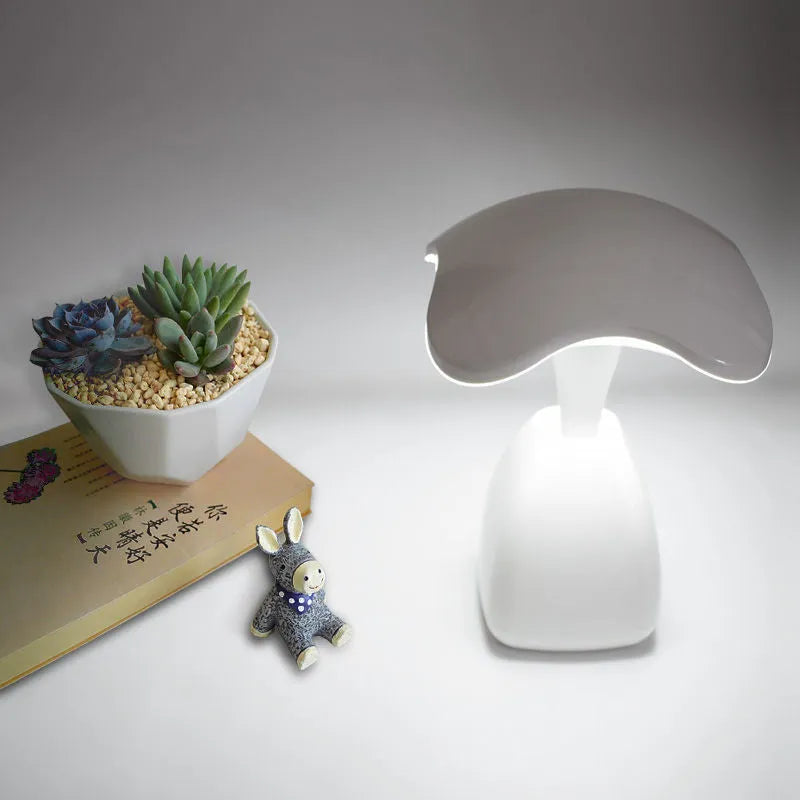 White modern LED desk lamp with touch controls and built-in battery for bedside use