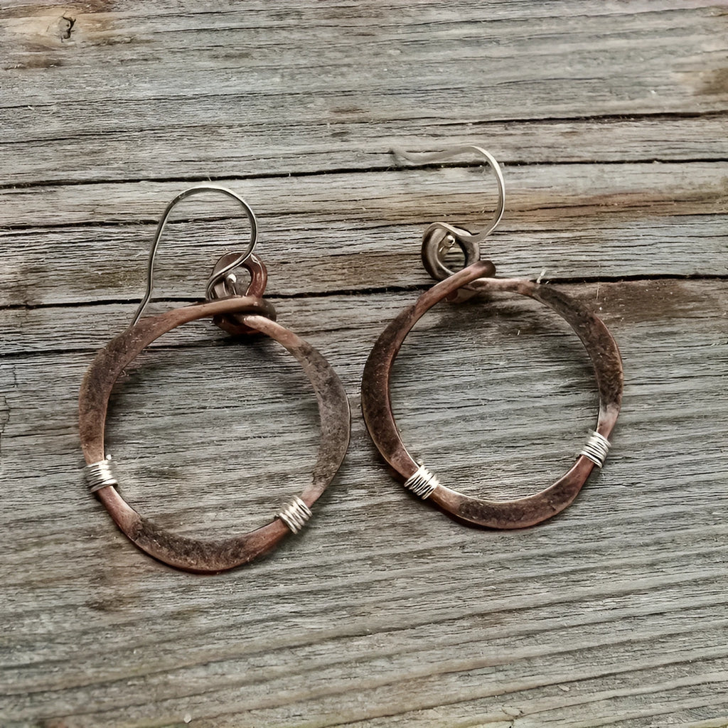 Pair of retro hollow round alloy earrings with bronze electroplated finish and geometric drop shape