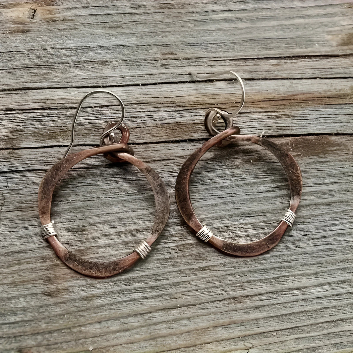 Pair of retro hollow round alloy earrings with bronze electroplated finish and geometric drop shape