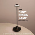 Modern UFO-shaped rechargeable table lamp in gold, grey, or black with touch dimming controls.