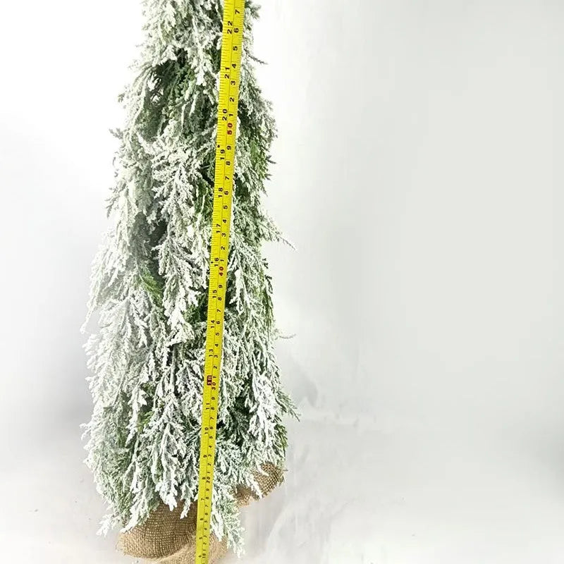 24-inch desktop artificial Christmas tree with LED lights and white snow finish on plastic branches