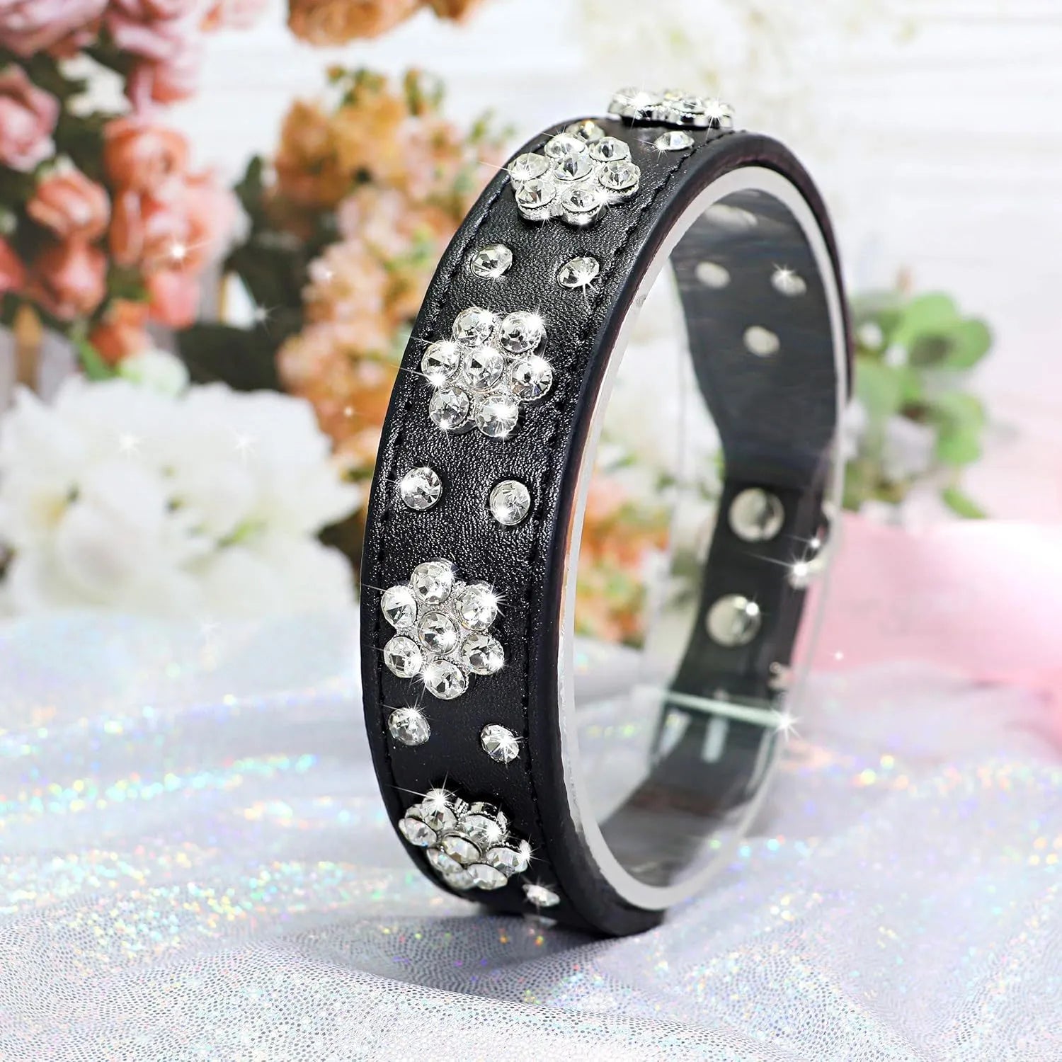 Rhinestone and studded flower pattern on a black adjustable PU leather dog collar with metal D-ring