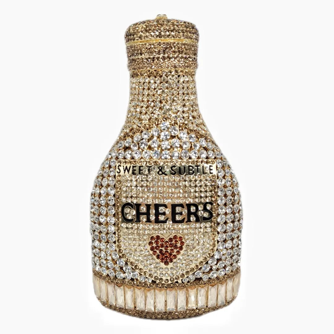 Gold hard evening clutch bag shaped like a champagne bottle with rhinestone decoration