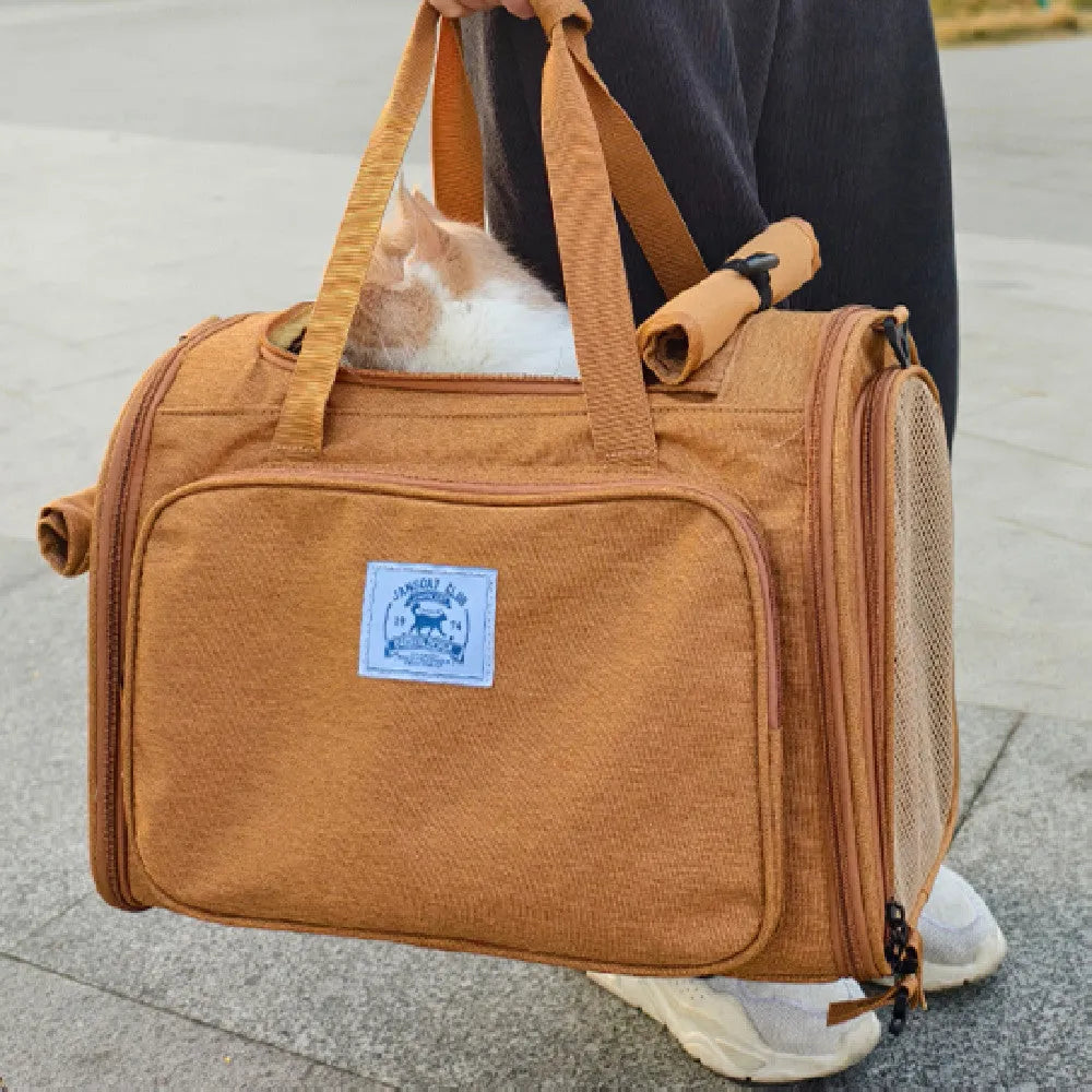 Brown portable cat bag with expandable tent design and shoulder strap for cats up to 15 lb