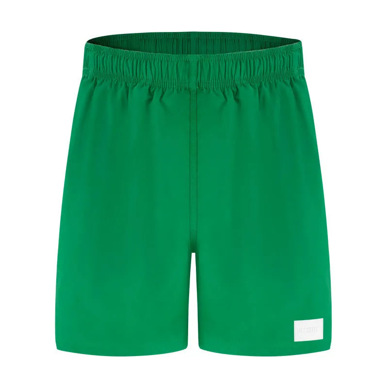Men's quick-drying nylon beach shorts in blue, shown laid flat, with straight-leg style and elastic waist.