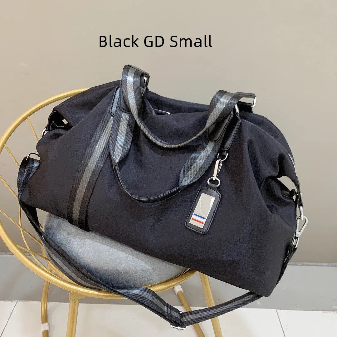 Men's black gold Oxford cloth travel bag with zipper opening and three shoulder straps shown on a neutral background