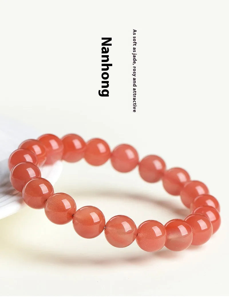 Natural South Red Cherry Agate bracelet showing polished beads in a single circle design.