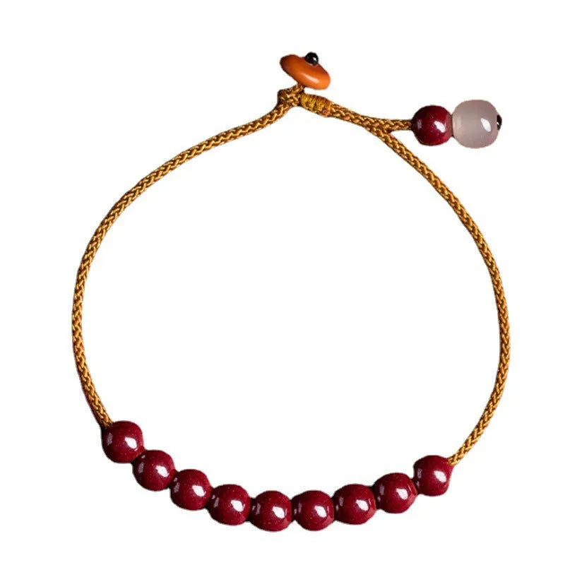 Cinnabar and Hetian jade geometric bracelet with hand-woven construction