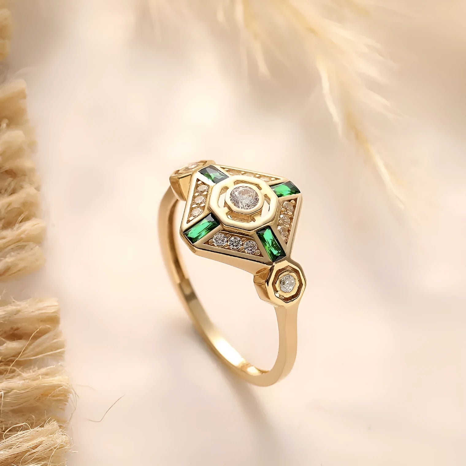 Geometric square emerald diamond ring in lvzuan colour on a model's hand.
