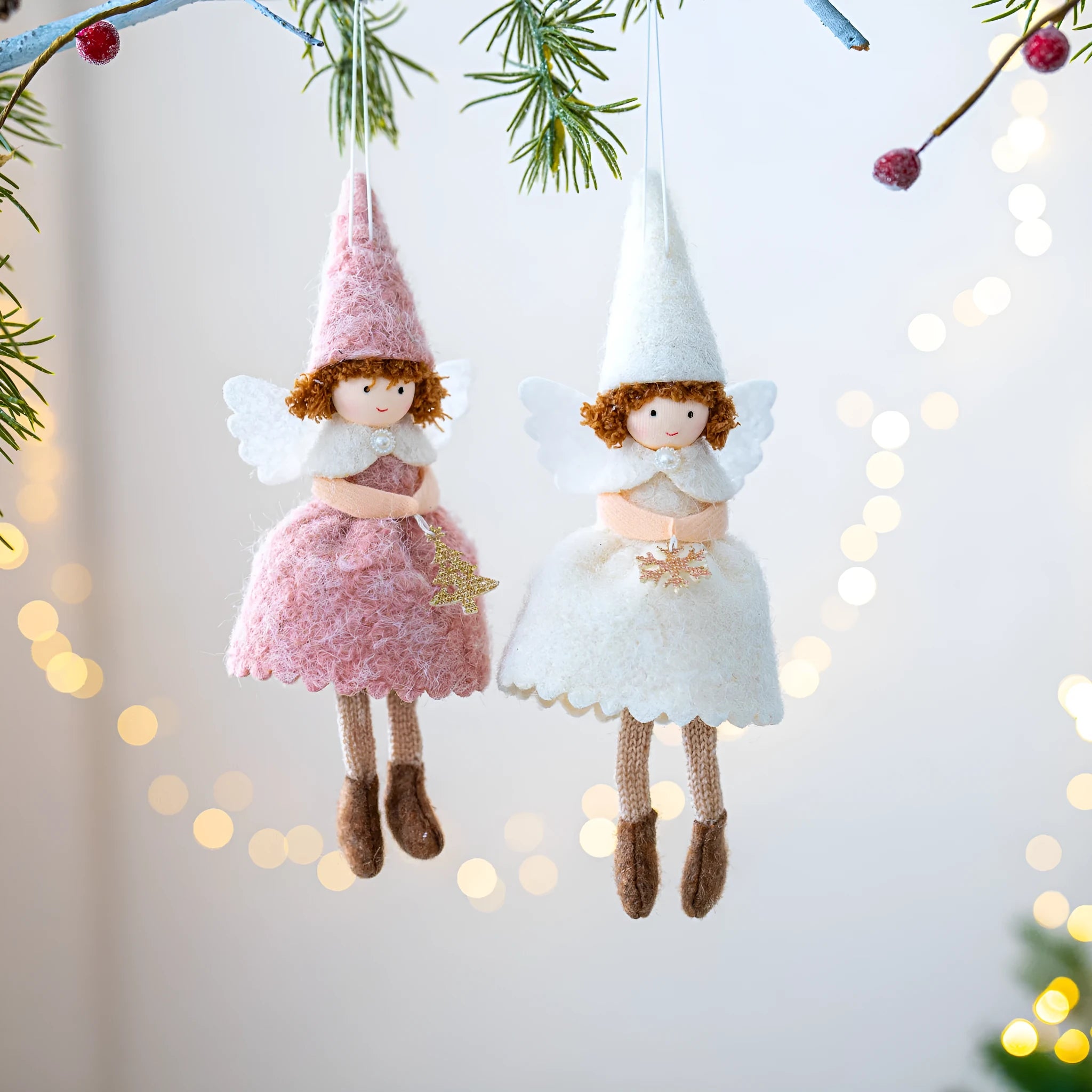 Close-up of a white cloth angel skirt felt pendant Christmas tree ornament.