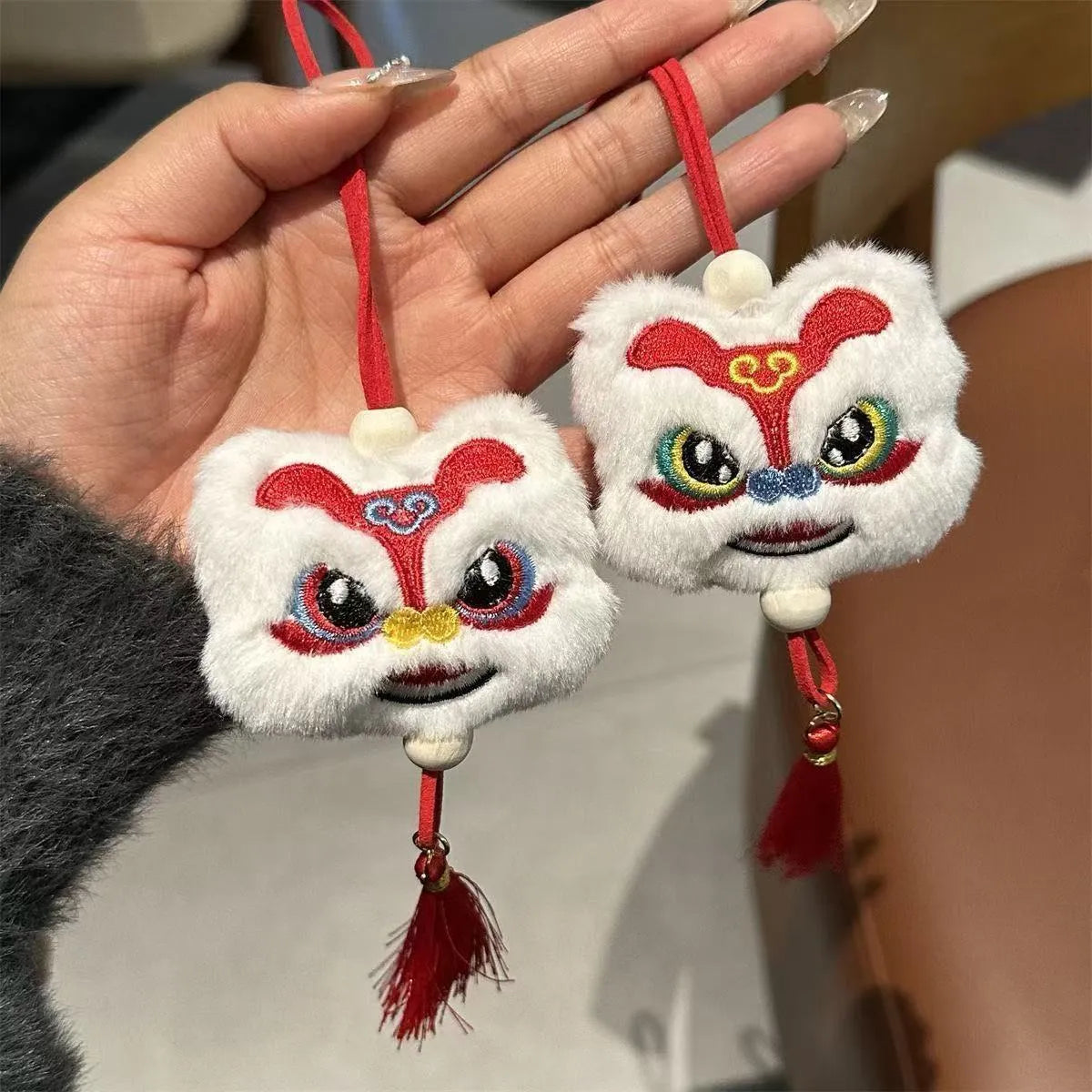 Chinese style blue and yellow plush lion keychain ornament with star stone decoration and cartoon styling