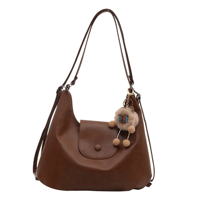 Women's PU leather shoulder bag with single strap in urban simplicity style showing horizontal square shape