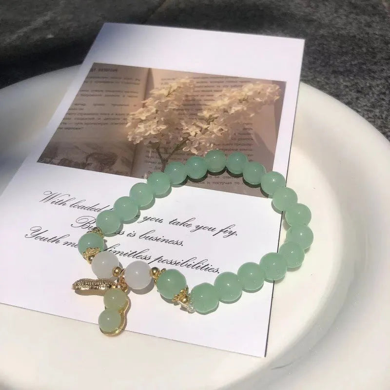 Chinese style glass bamboo leaf bracelet for women with manual craft details.