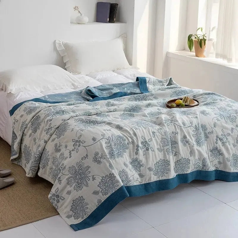 Five-layer gauze cotton bed sheet blanket in Roulette Wheel Blue pattern showing modern simplicity design