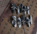 False nails with rose floral patterns in night blue colour, size options displayed