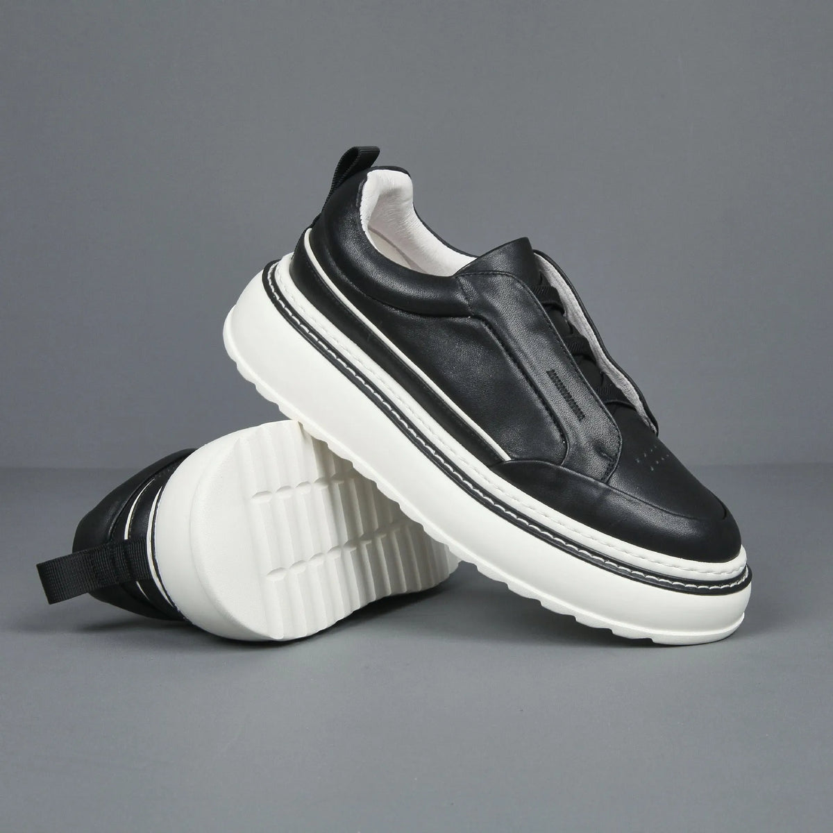 Black breathable first layer cowhide slip-on sneaker with elastic band foam sole low top platform mid heel round toe