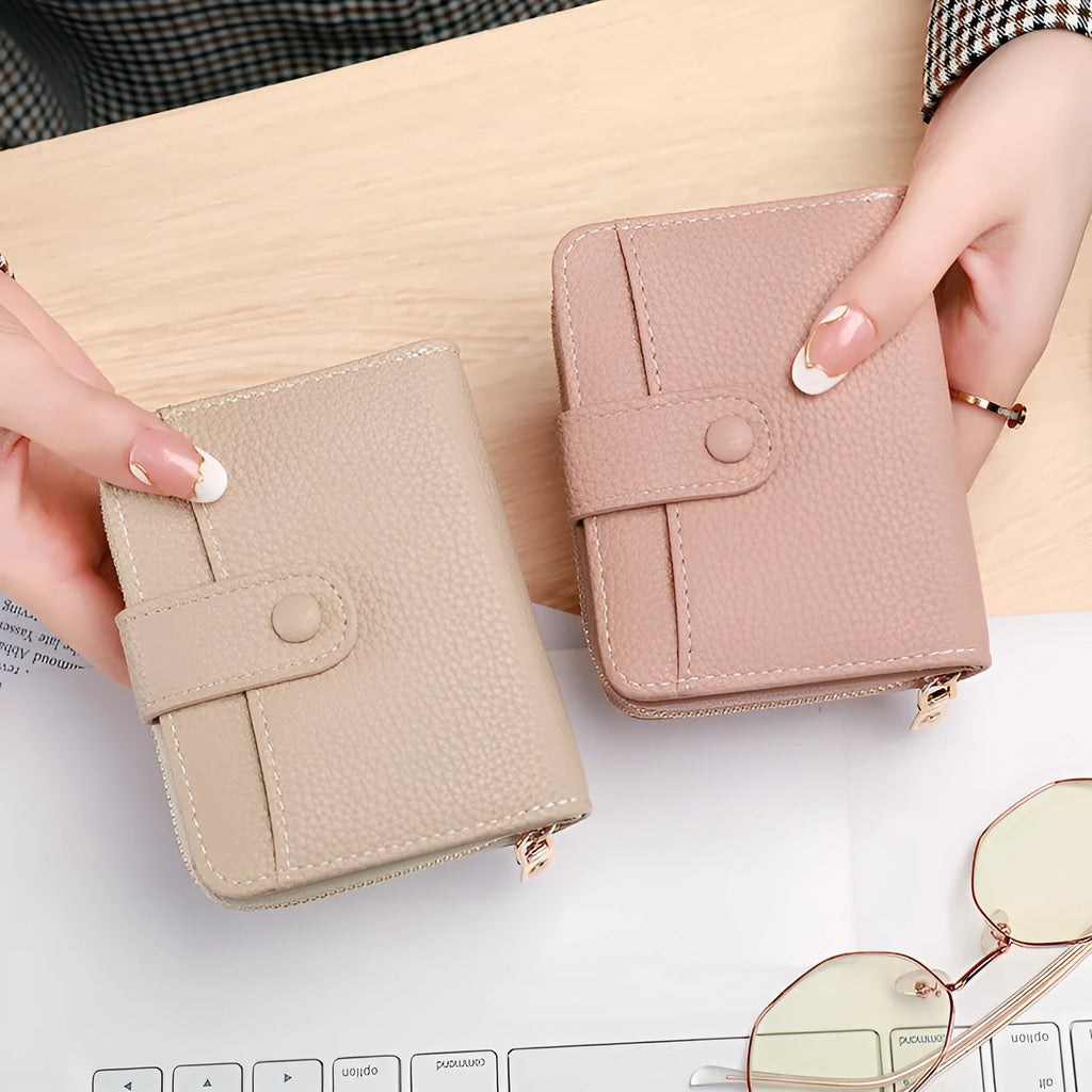 Women's lychee pattern organ short wallet in pu leather available in beige pink black and red colours