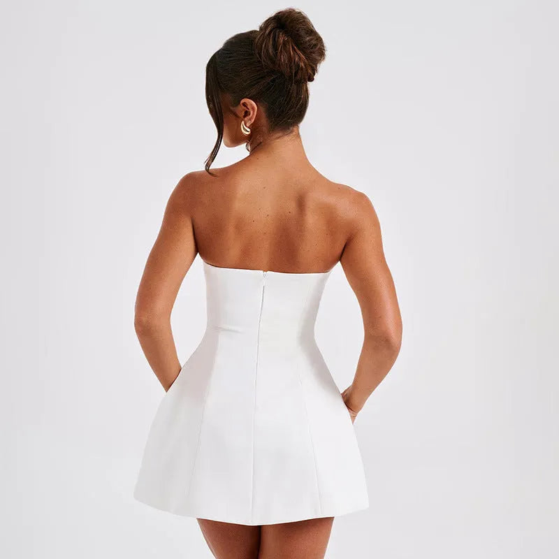 Women's short backless A-line tube dress in a solid colour on a model.