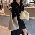 Casual PU shoulder bag for women with visible sewing thread detail in black