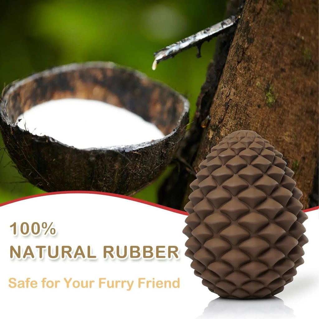 Yellow pine cone shaped natural rubber dog toy with textured surfaces and treat dispenser