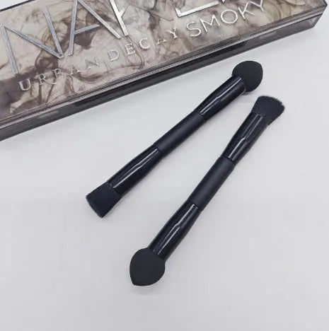 Double-headed makeup brush with black miter sponge and artificial fibre bristles on wooden handle