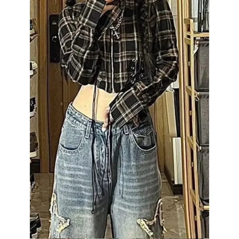 Blue high-waisted wide-leg denim pants with straight-leg silhouette on hanger