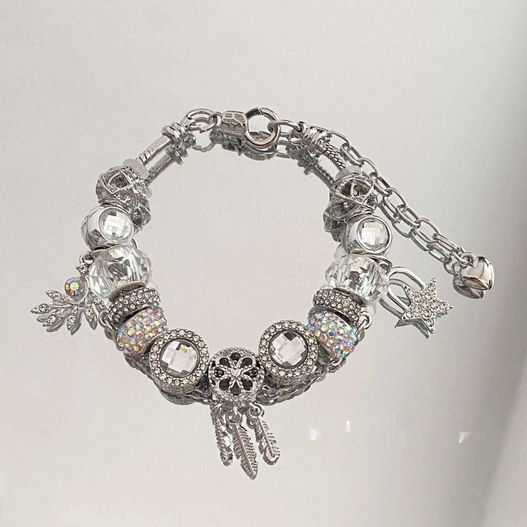 Women's dream catcher star bracelet with colourful crystals and electroplated finish on a white background