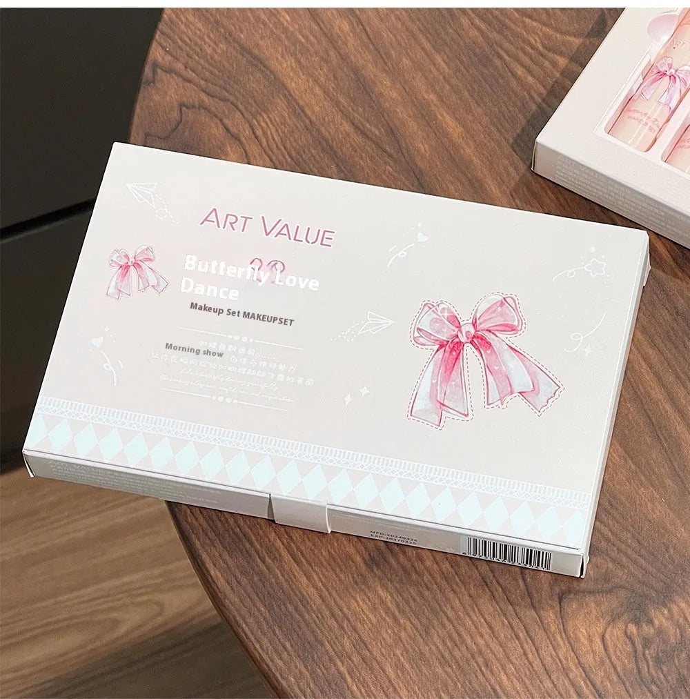 Butterfly Box makeup set with four pink lip mud containers, powder blusher, and necklace